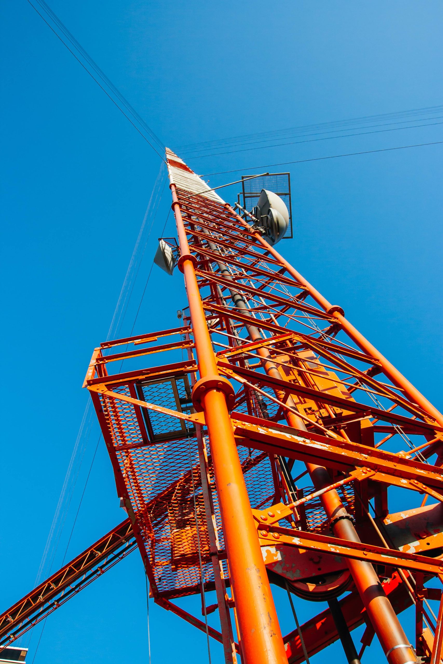 View of a large orange antenna from the ground